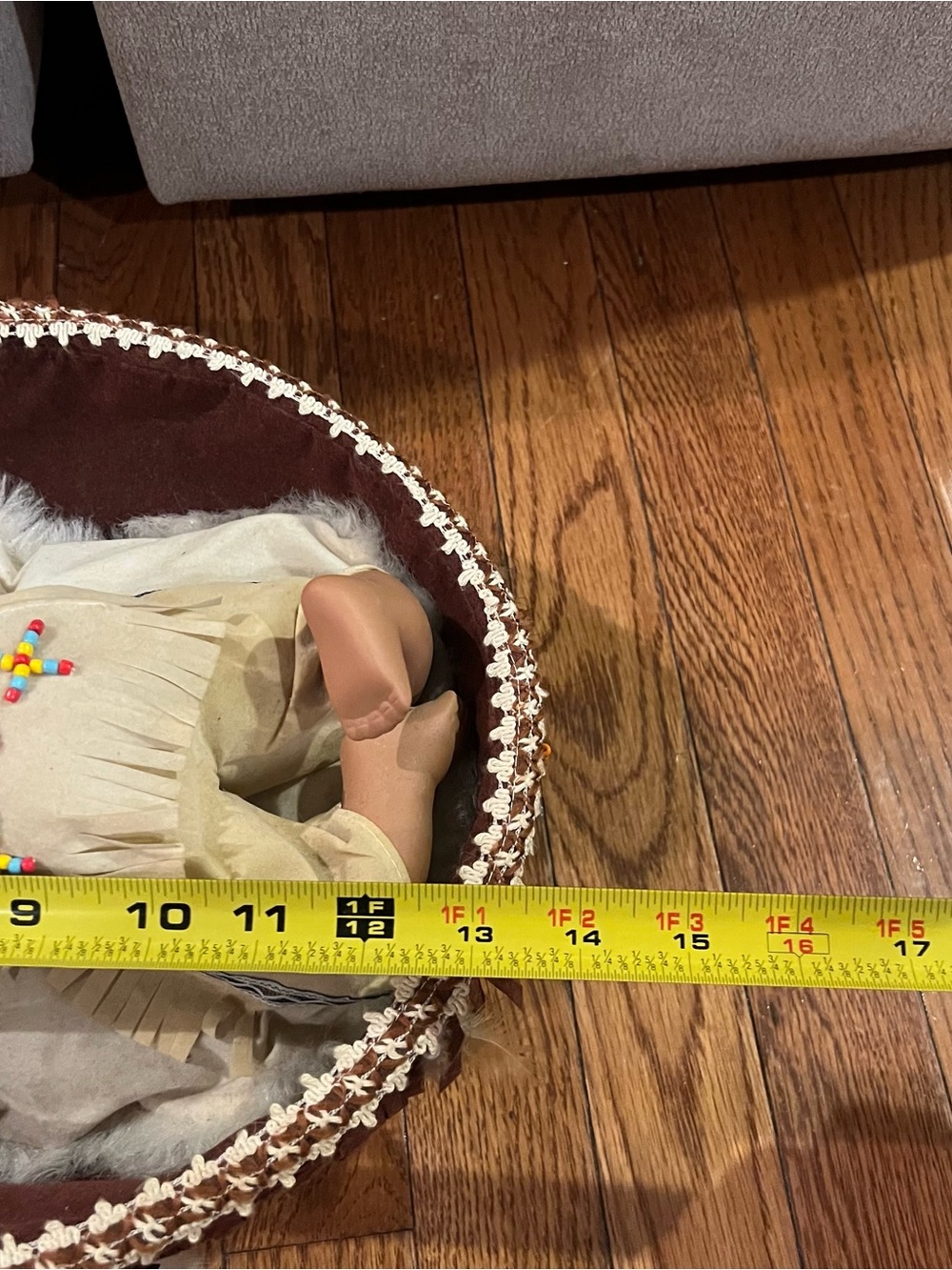 Sleeping Porcelain Native American-Inspired Doll w/
Decorative Cradle